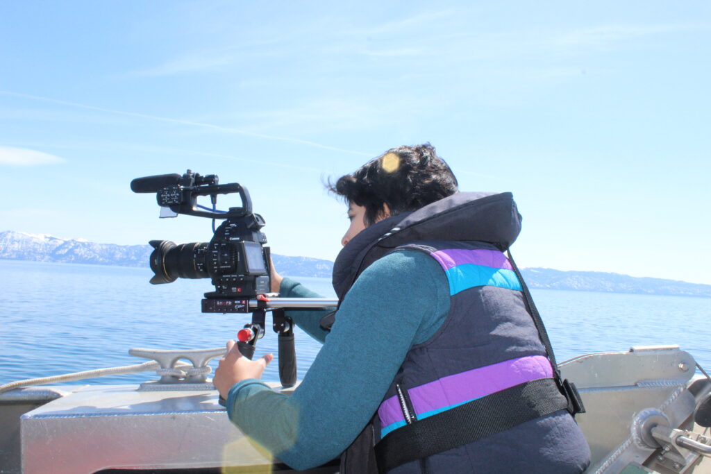 Vanesa recording video materials on a UC Davis research boat in Lake Tahoe.